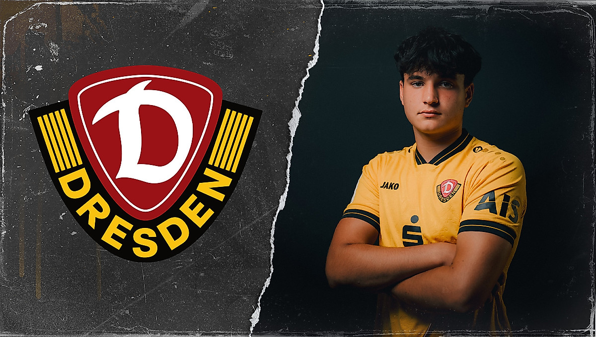 Filip Zahalka neben dem Dynamo-Wappen.