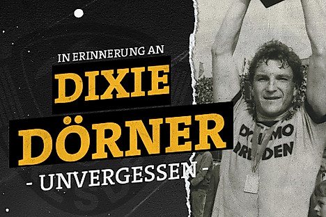 Hans-Jürgen "Dixie" Dörner reckt einen Pokal in die Höhe.